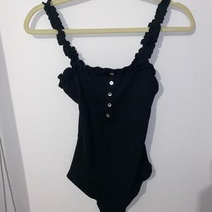 Black bodysuit with white buttons